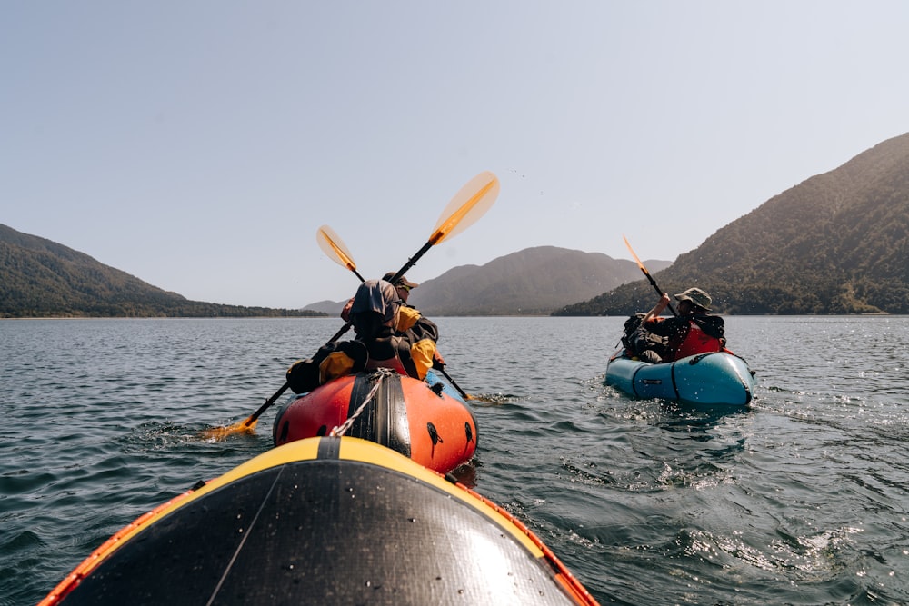 a group of people in kayaks