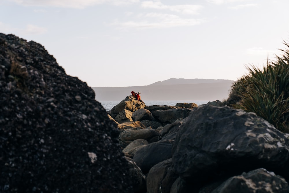 a person climbing a rocky hill