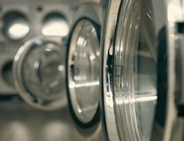 a row of silver and black washing machines