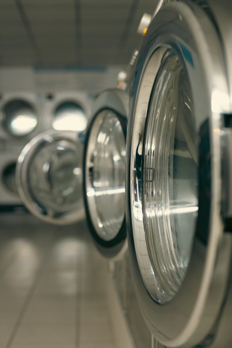 Close-up of a stainless commercial washer door
