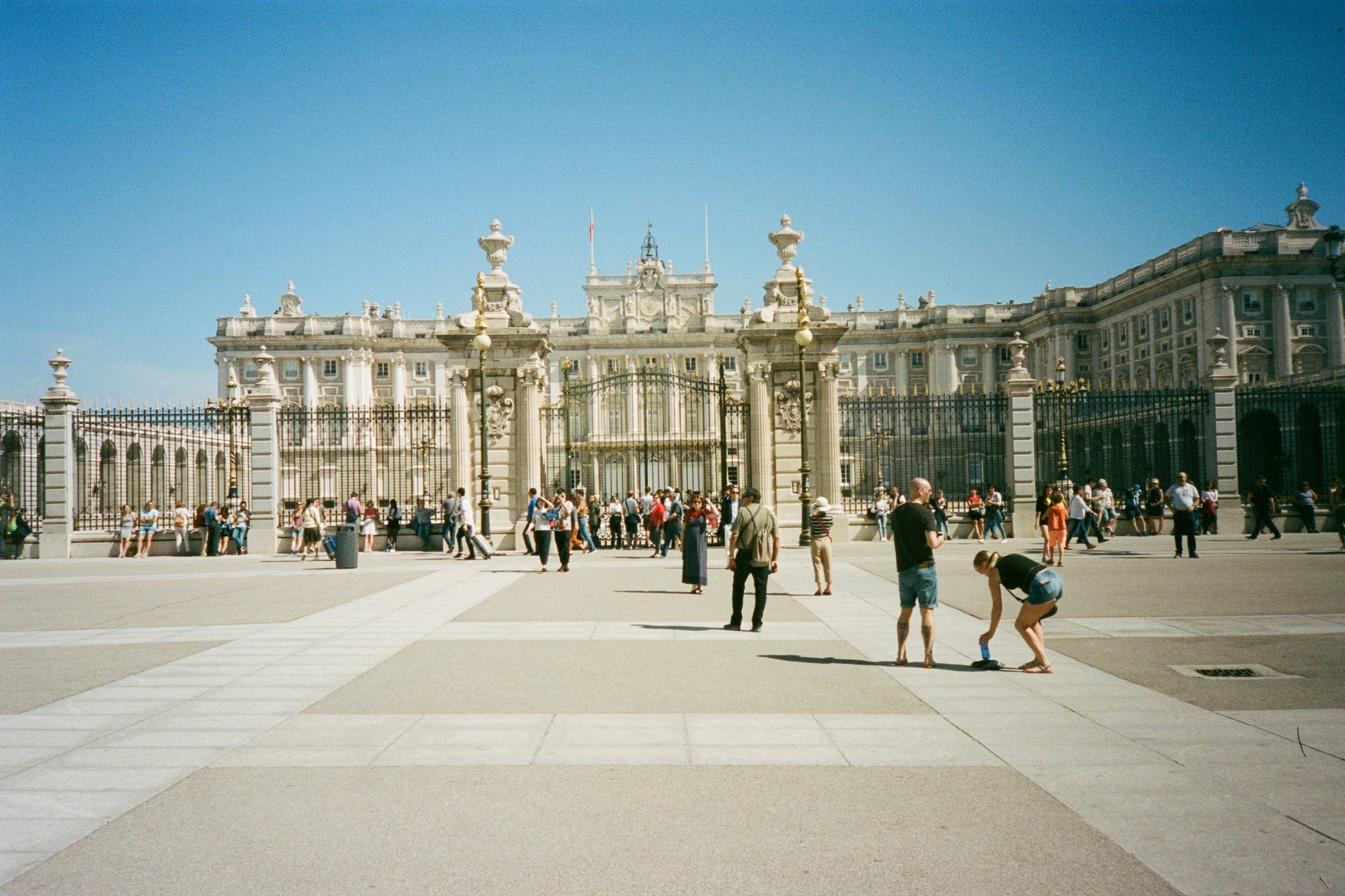 a large building with columns and people in front of it