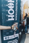 a hand holding a bottle