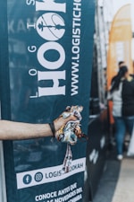 a hand holding a bottle