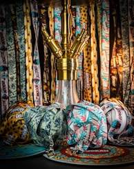 a lamp and vases on a table