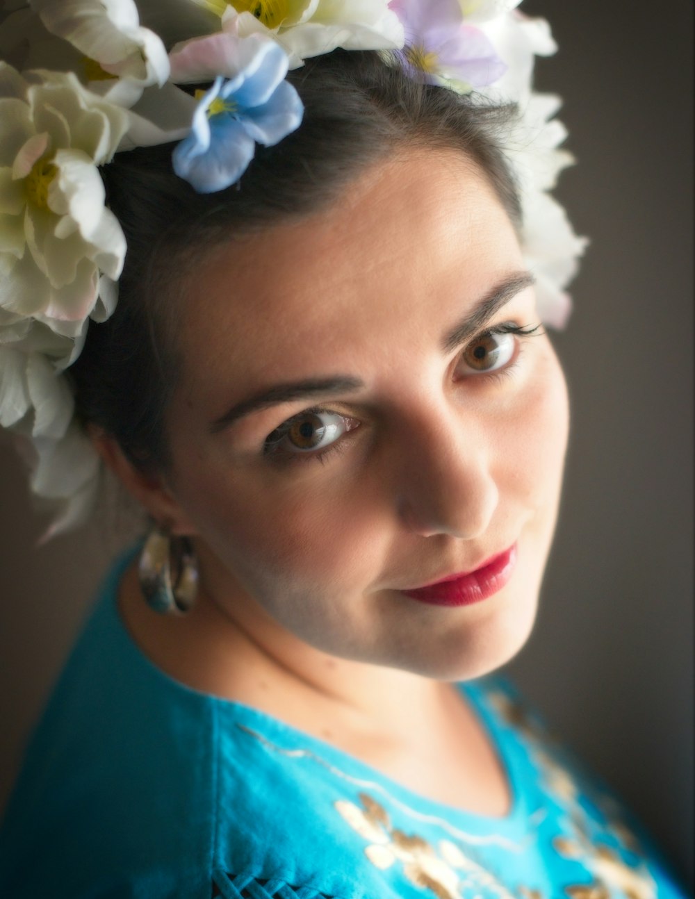 a person with flowers on the head