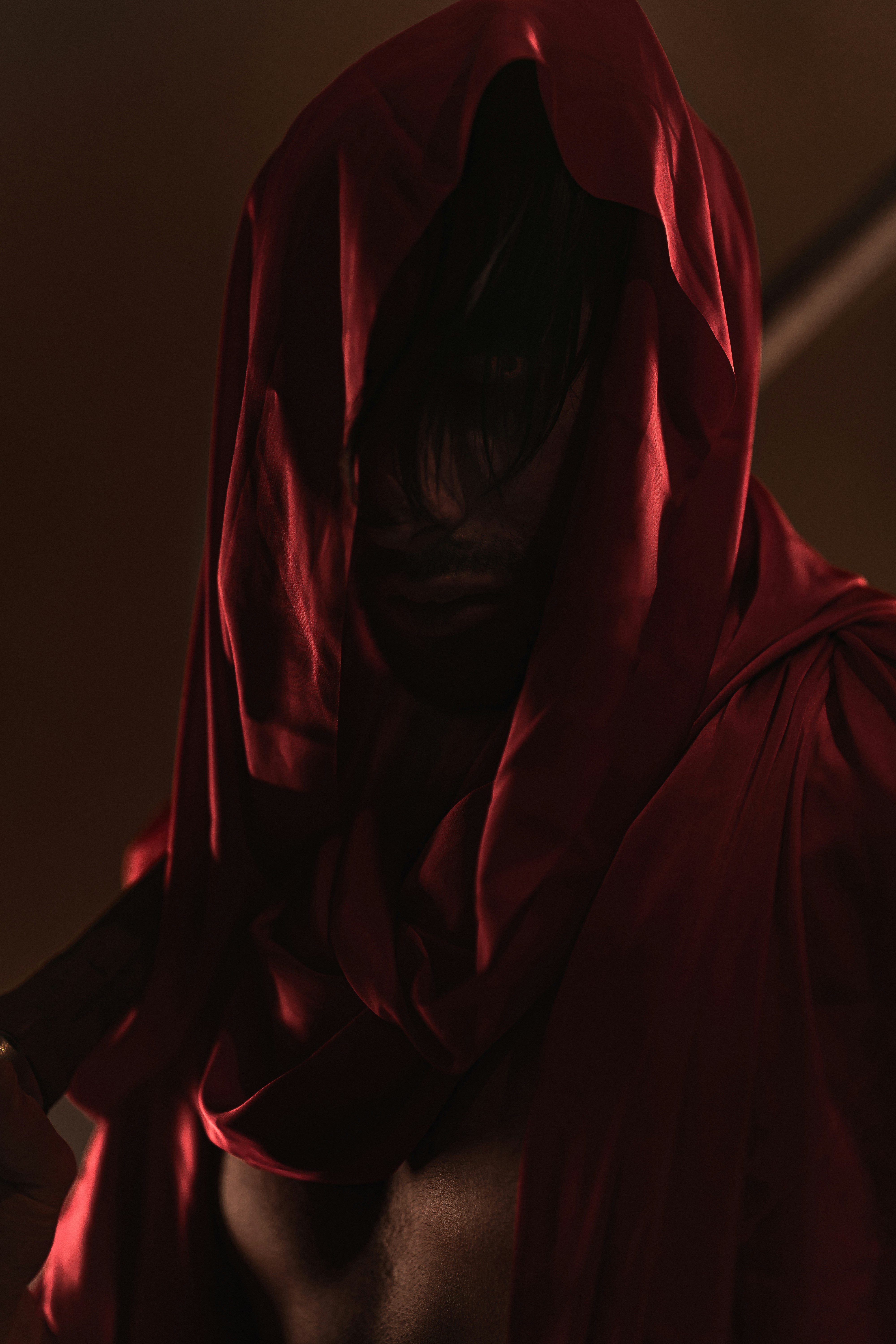 a person wearing a red hoodie