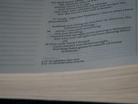 A close-up view of a page from a book containing text printed in a serif font. The subject matter appears to be religious or philosophical, given the references to human nature. The page also features footnotes indicated by small letters next to some of the text.