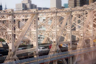 A detailed 3D rendering of a modern bridge with VR headset overlay.