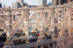 A detailed 3D rendering of a modern bridge with VR headset overlay.