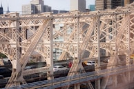 A detailed 3D rendering of a modern bridge with VR headset overlay.