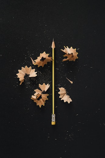 a yellow pencil with leaves