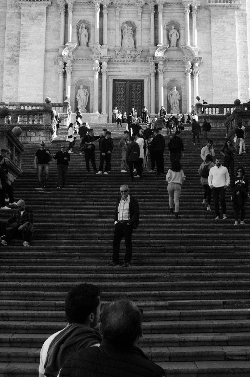 a group of people standing on stairs