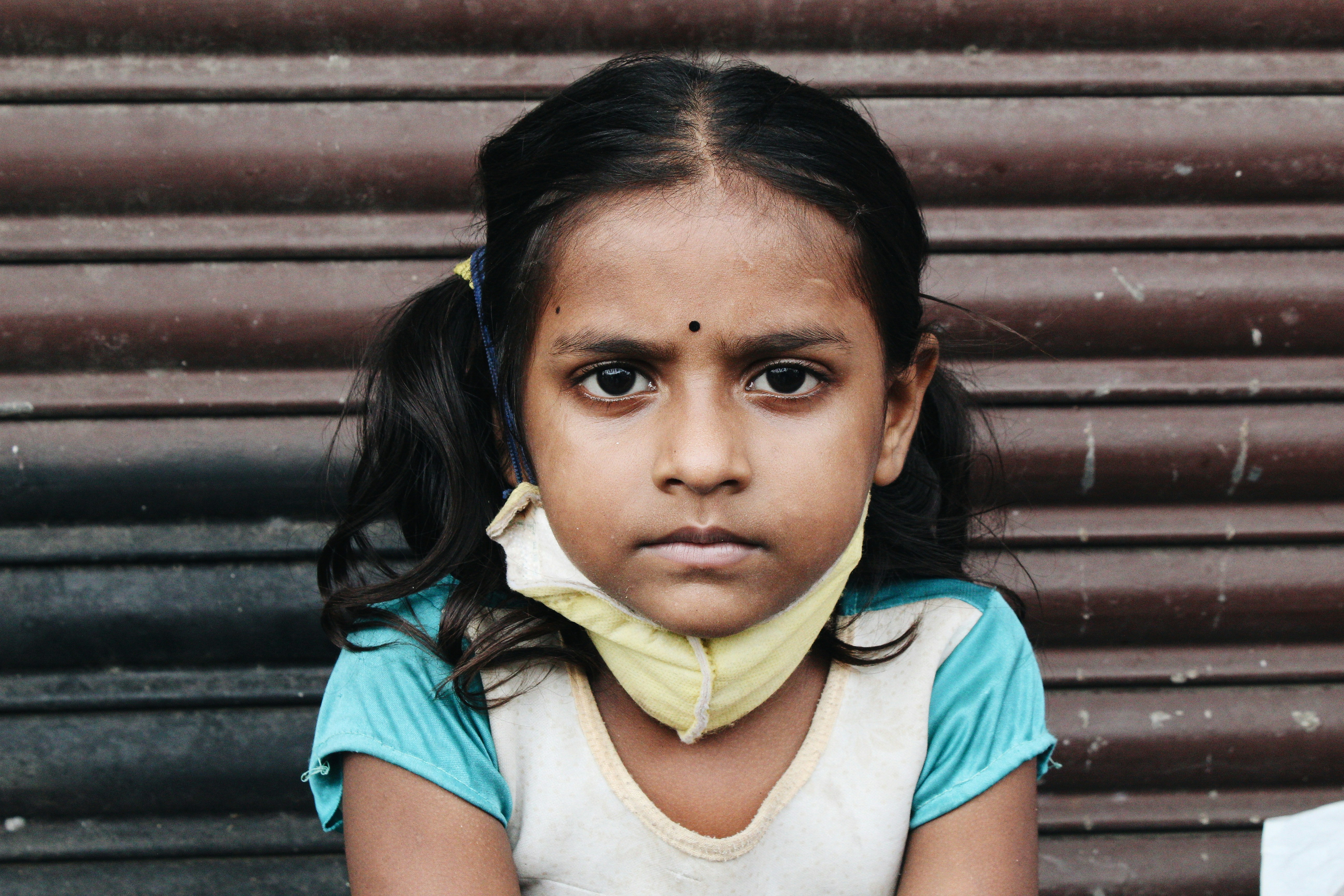 a girl with a scarf on her head