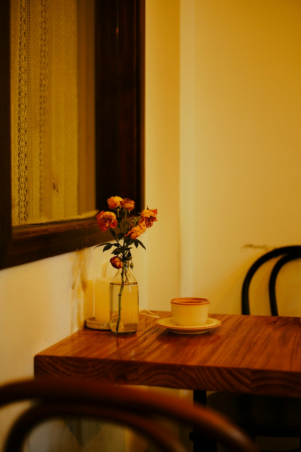 a vase with flowers on a table