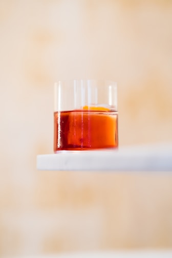 a glass with a liquid in it