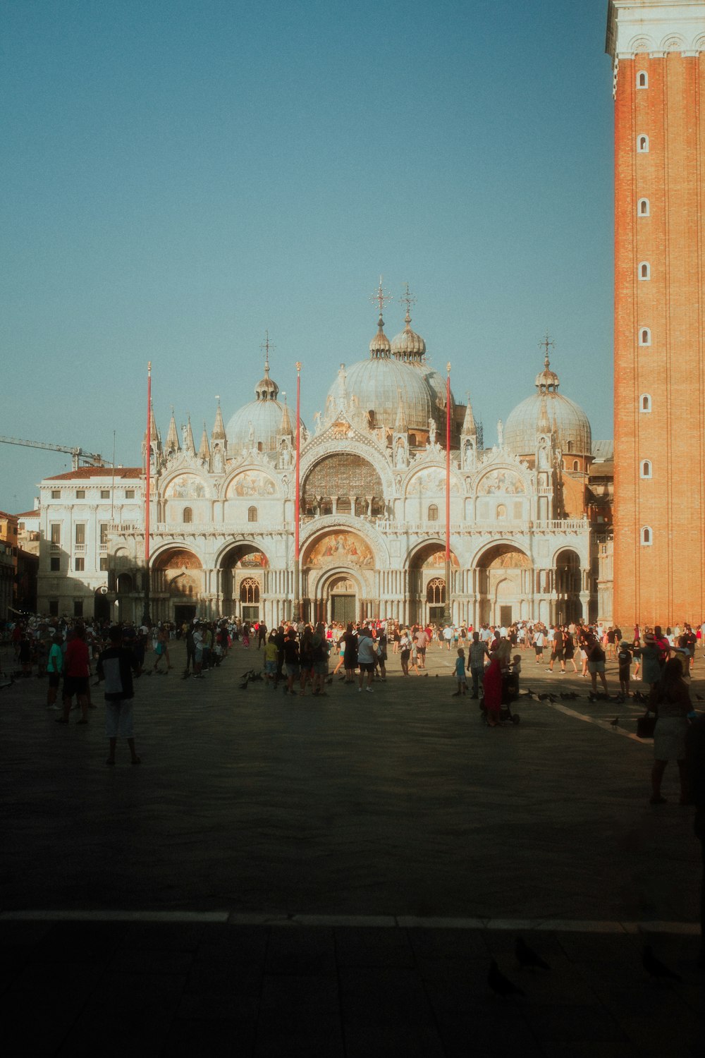 a large building with a dome and many people in front of it