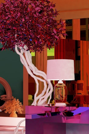 A modern, vibrant interior featuring a stylized tree with twisting white branches and dense, angular red foliage. A lamp with an ornate, translucent base sits on a reflective surface. The background is a mix of bold colors and abstract shapes, creating a dynamic visual composition.