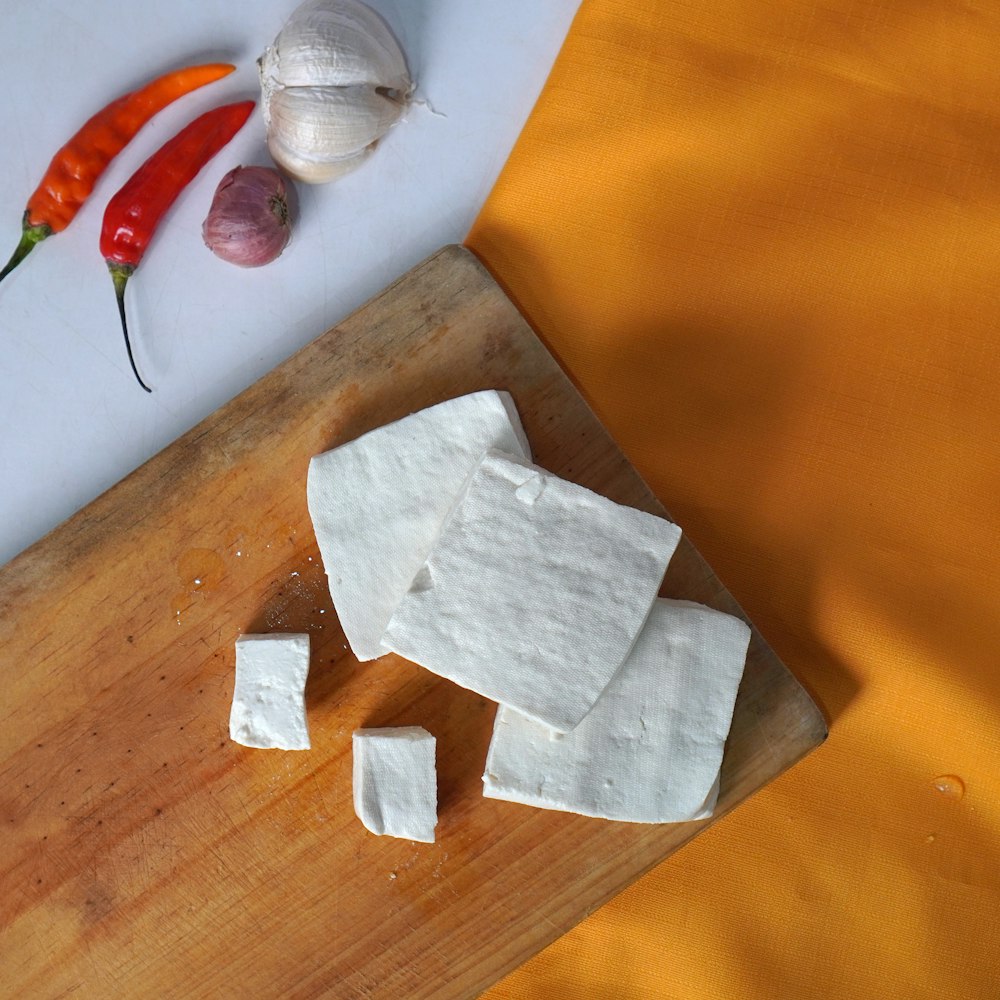 a white napkin on a cutting board