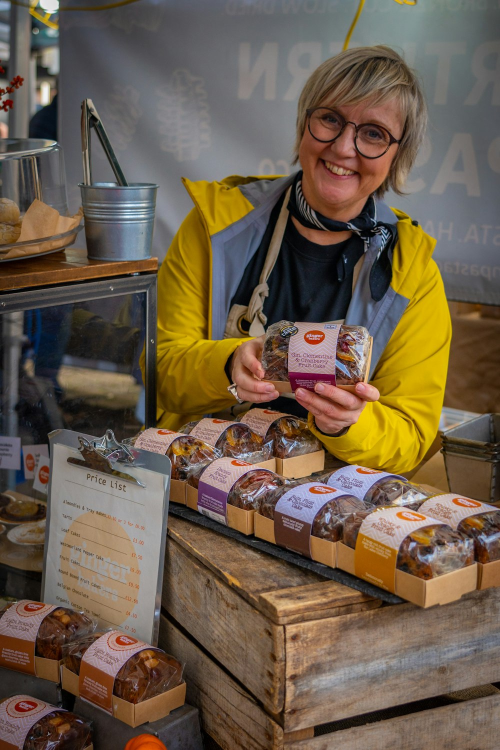 a person holding a box of cookies