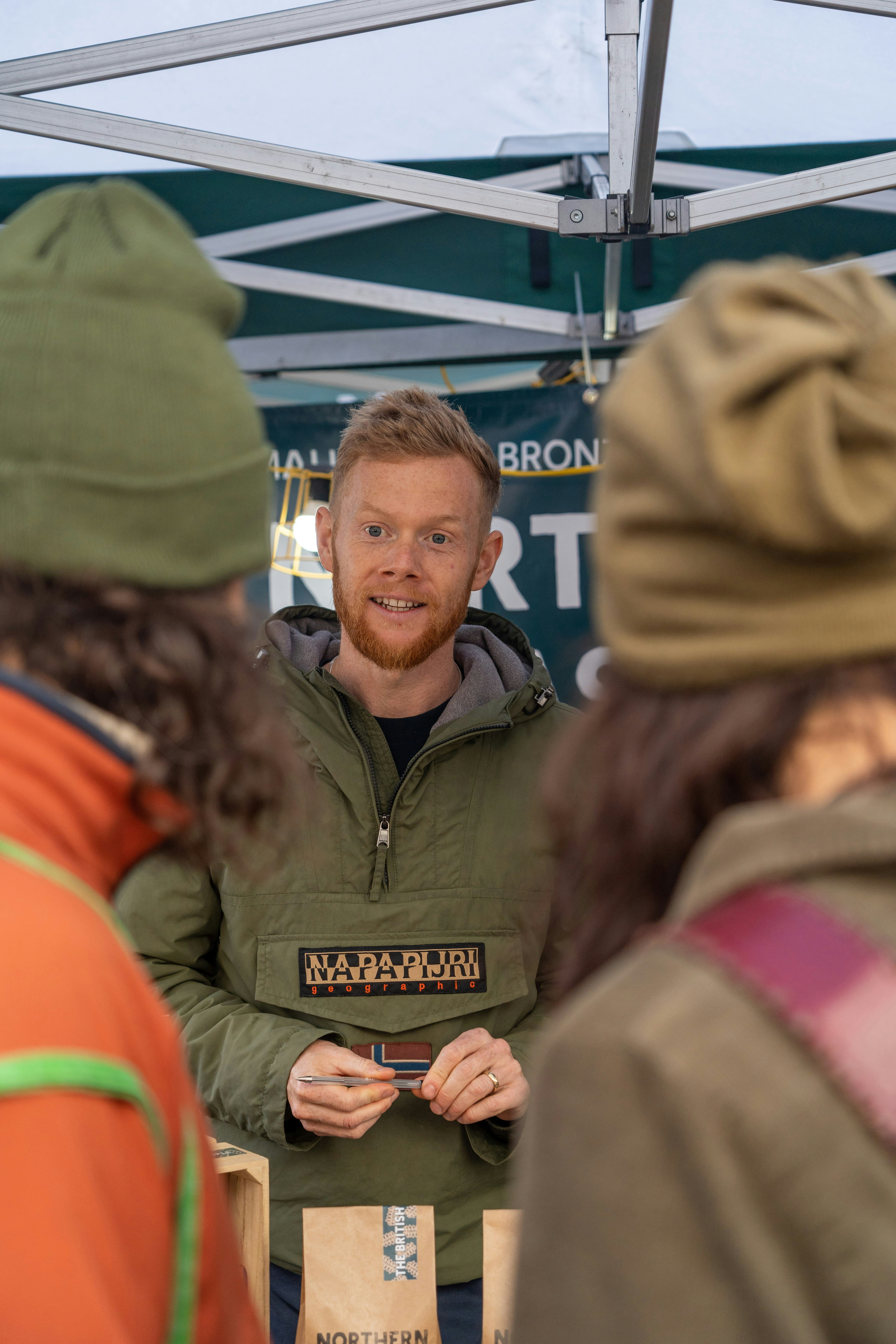 a person in a green jacket