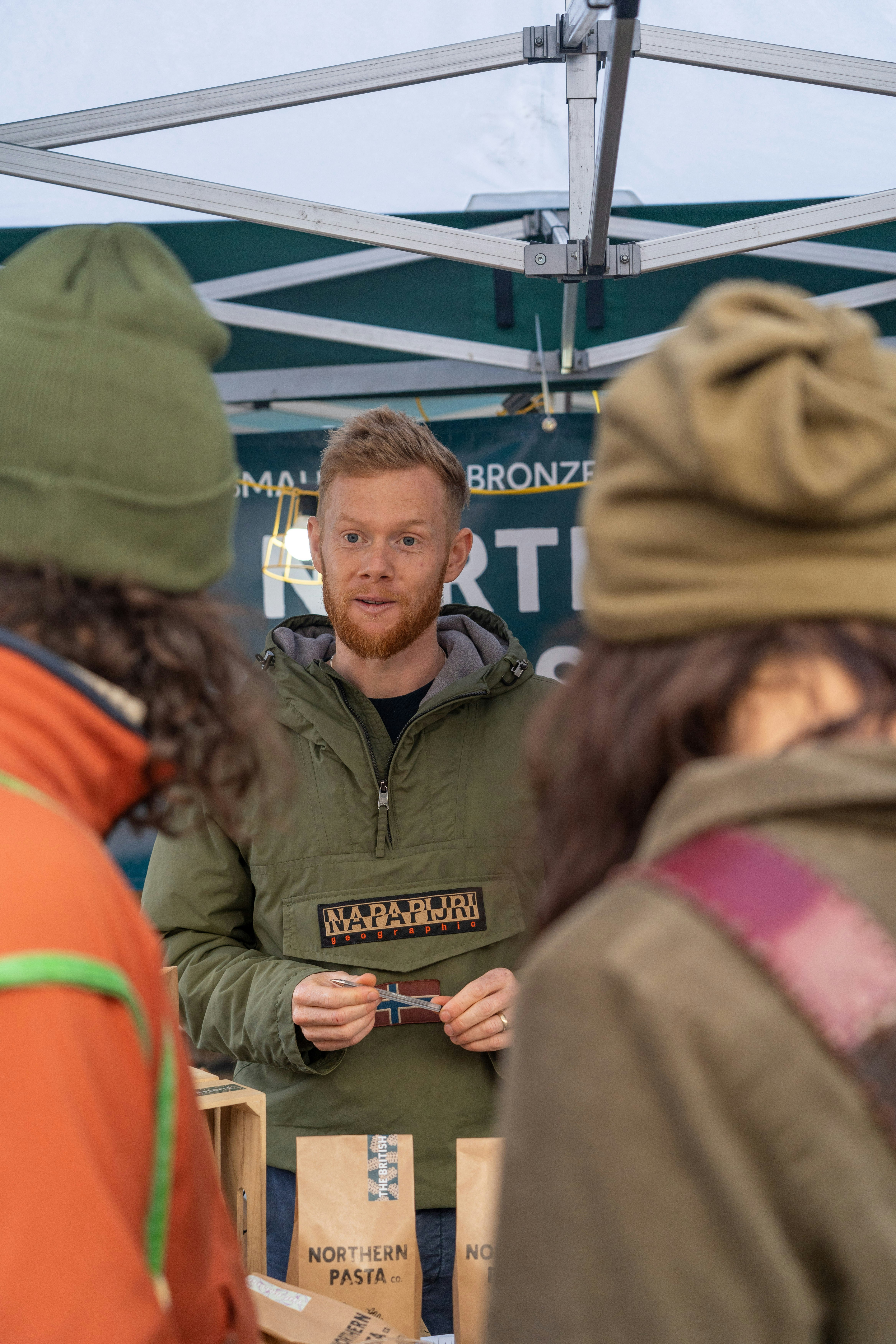 a person in a green jacket