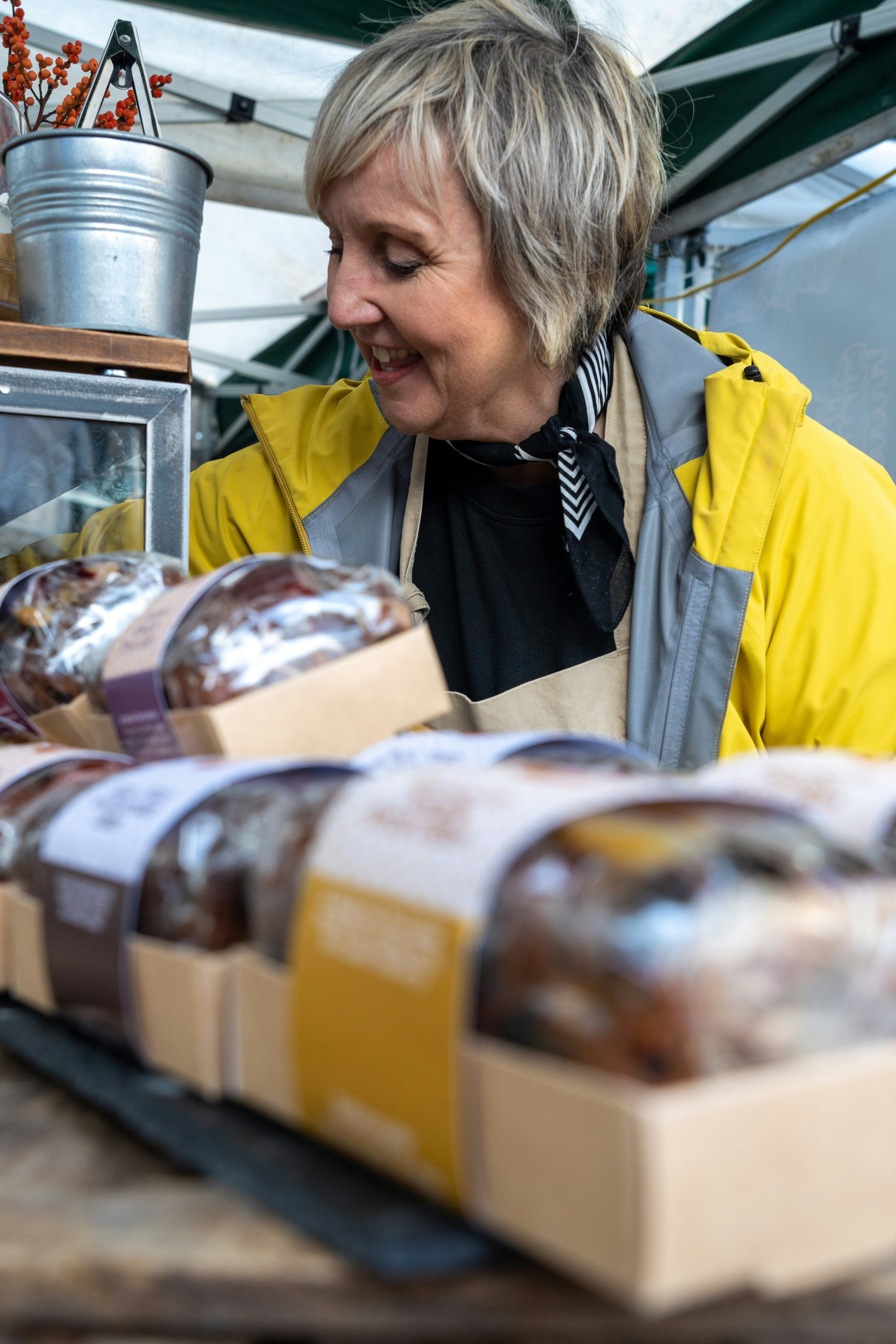 a woman looking at a box of chocolates