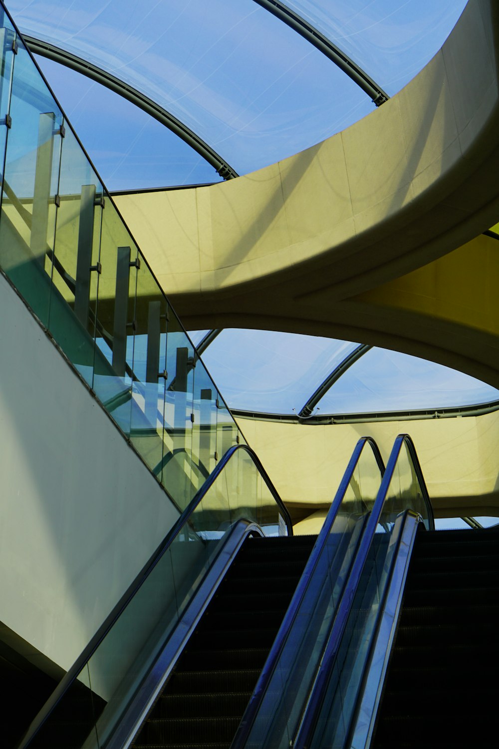 a staircase leading up to a glass ceiling