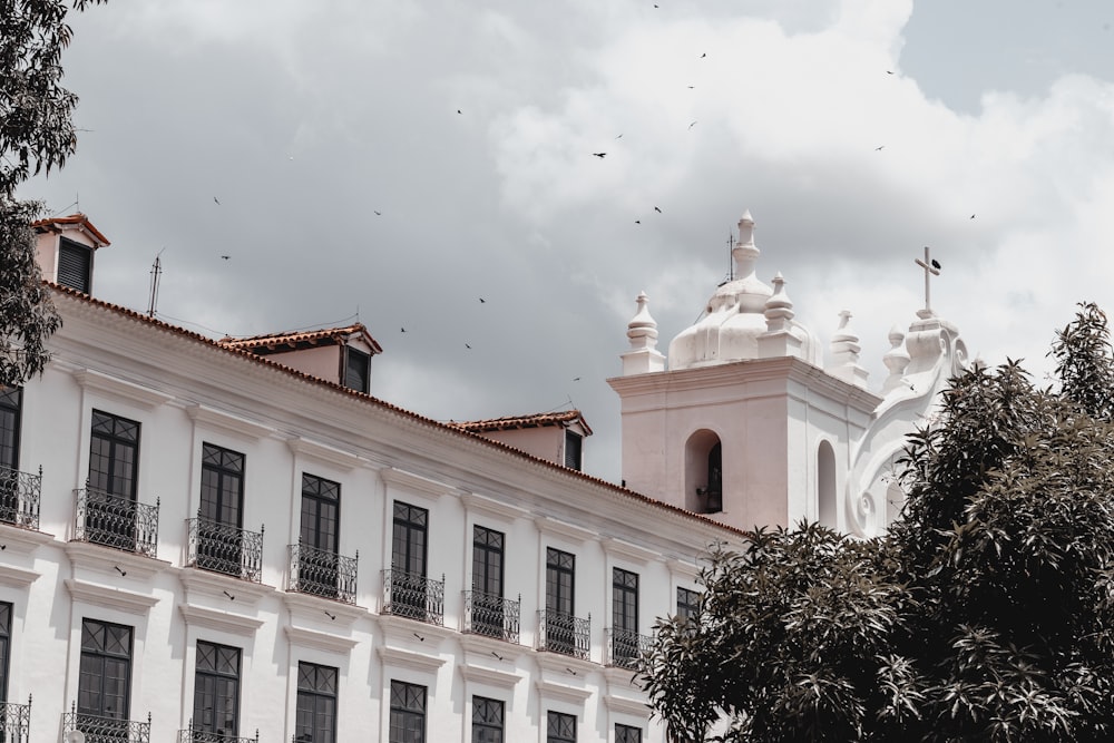 a white building with a cross on top