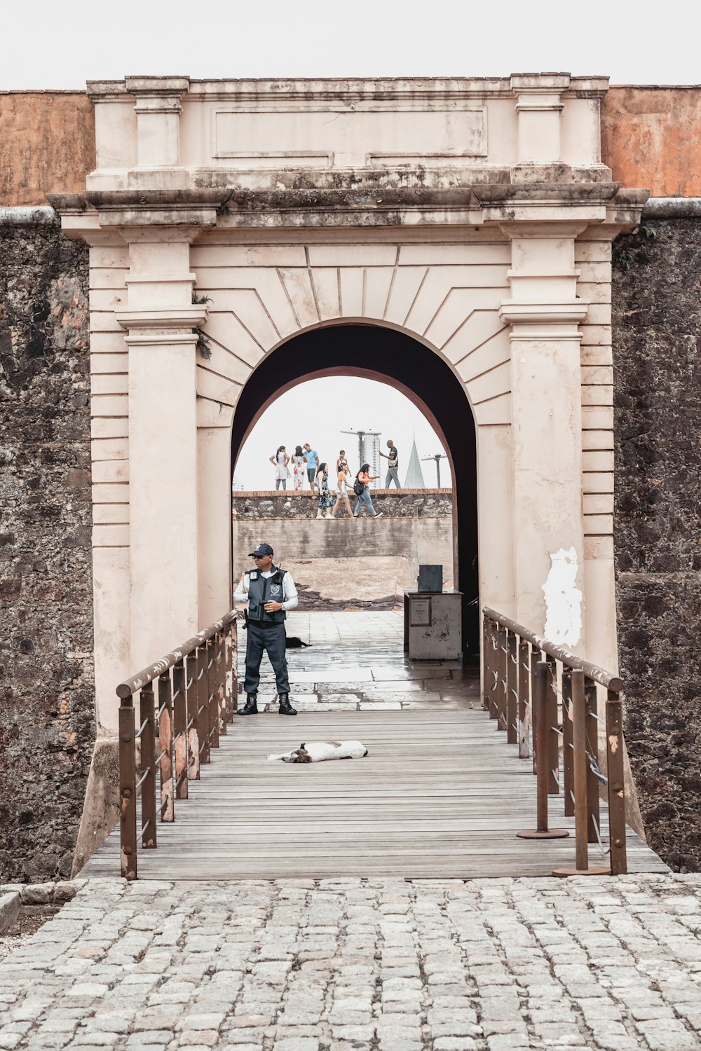 a person standing on a stone walkway