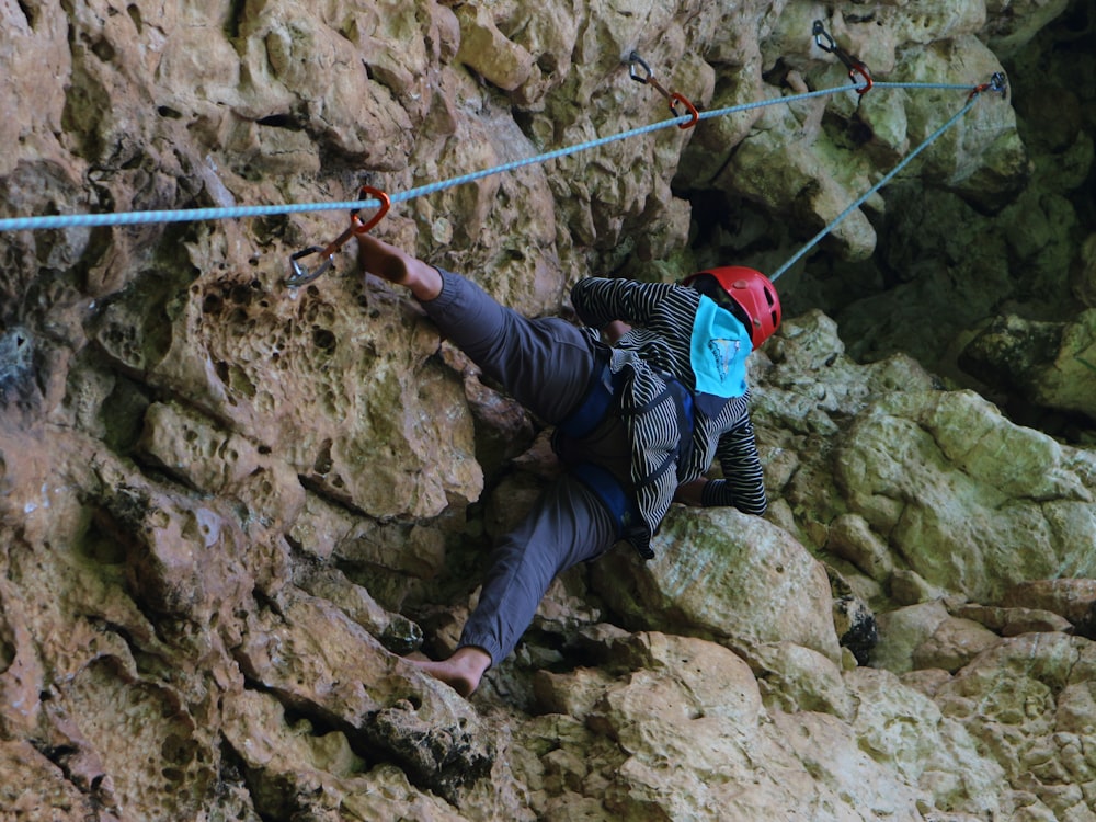 a person climbing a rock wall