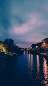 The serene Pearl River at dusk, with city lights reflecting on the water.