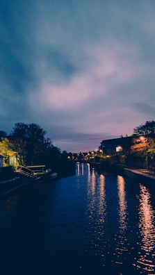 The serene Pearl River at dusk, with city lights reflecting on the water.