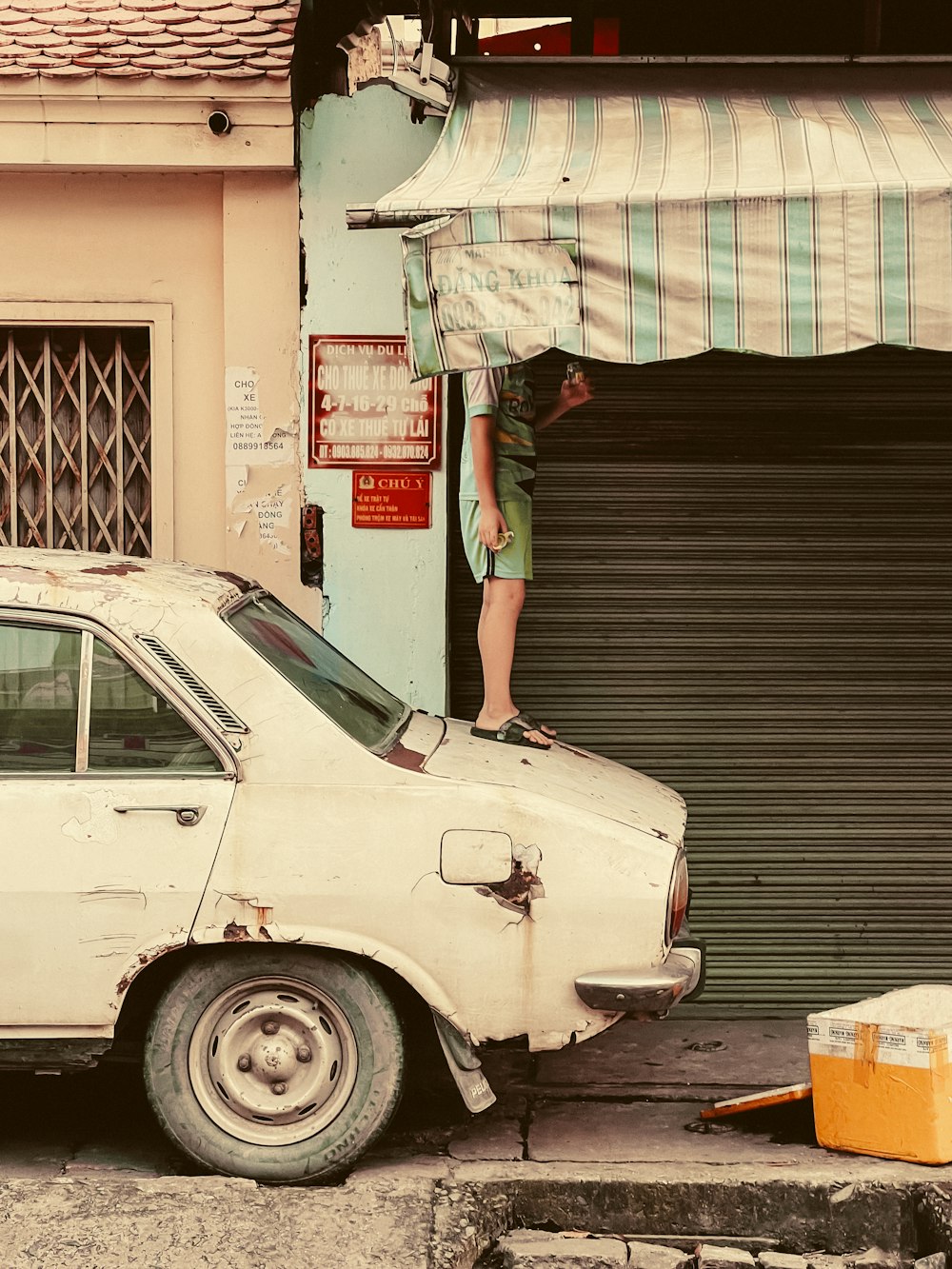 a person standing on top of a car