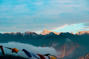 a view of snowy mountains and blue sky
