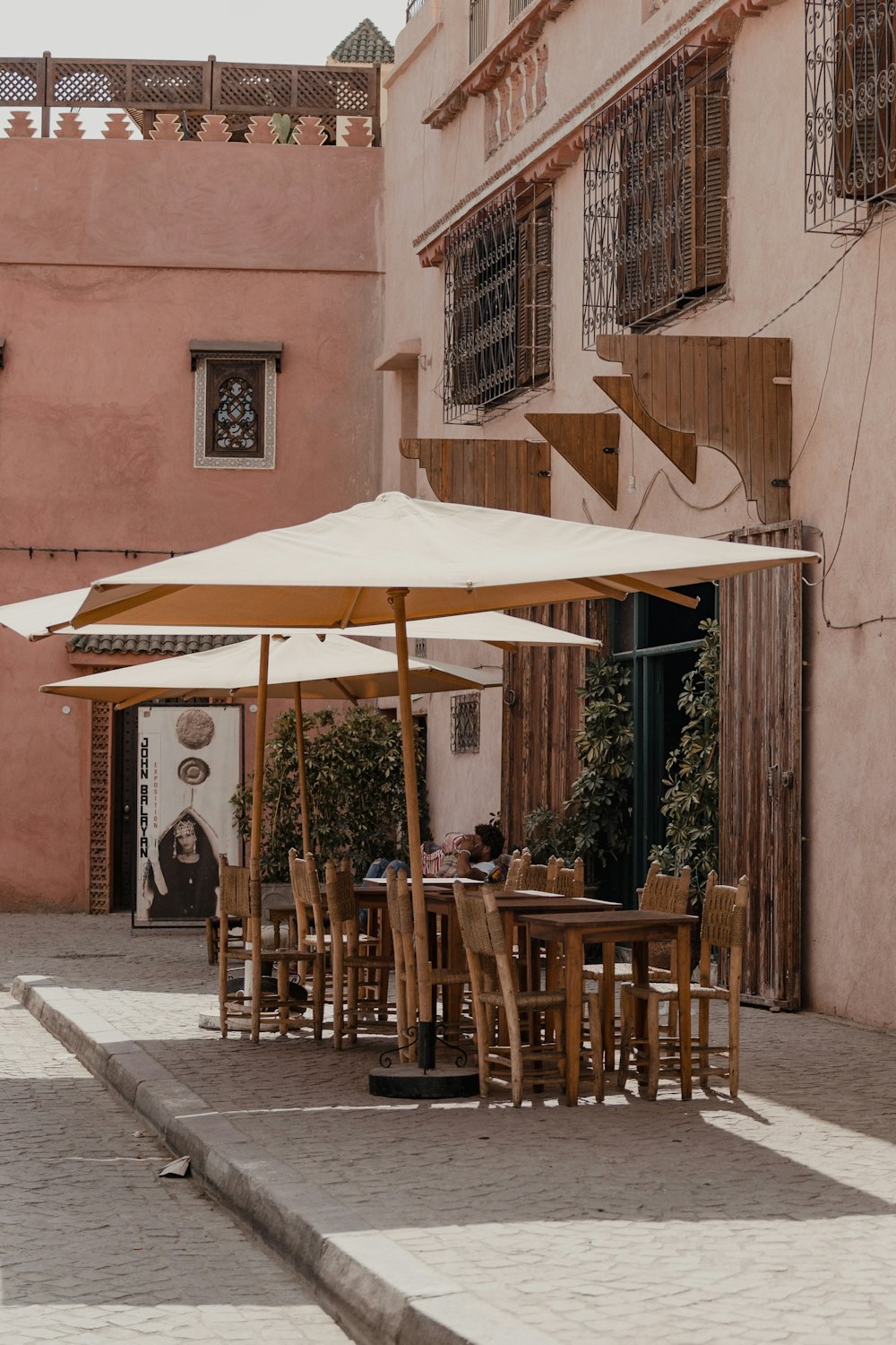 a table and chairs outside a building