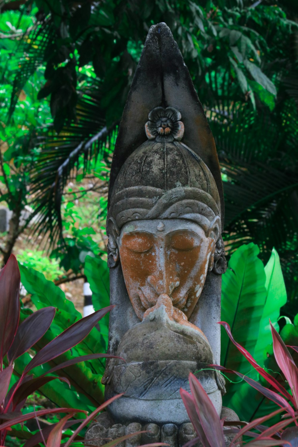 a statue of a person with a beard and a hat