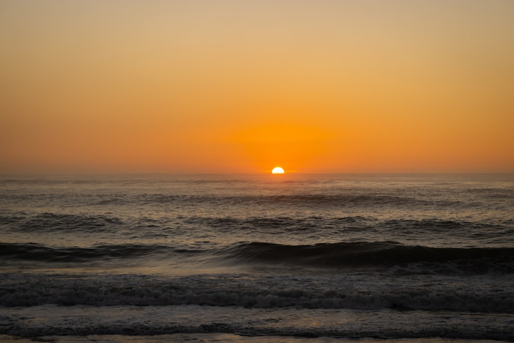 a sunset over the ocean