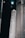 A large rocket labeled 'US Air Force' is positioned in a dark, industrial setting. The rocket is primarily white with bold black lettering, and there are other large structural components visible in the background.