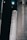 A large rocket labeled 'US Air Force' is positioned in a dark, industrial setting. The rocket is primarily white with bold black lettering, and there are other large structural components visible in the background.