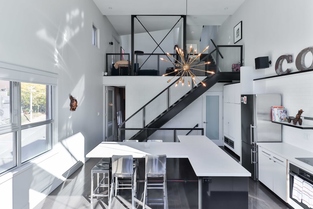 a kitchen with a staircase