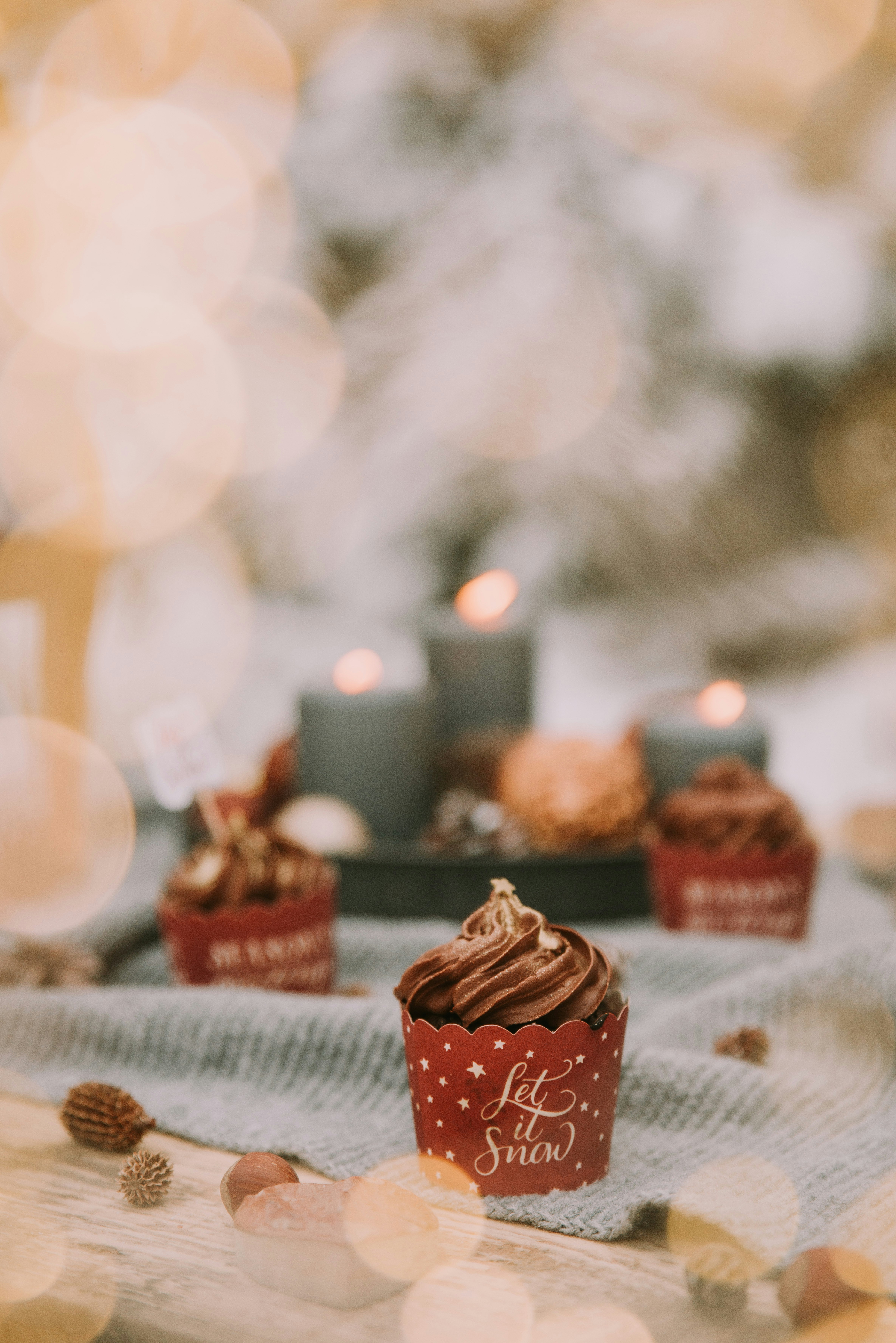 Assorted personalised party favour wrappers spread on a decorated table in bright natural light