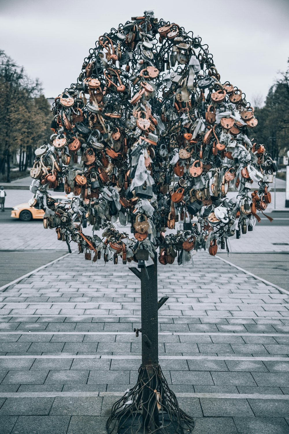 a tree with many statues