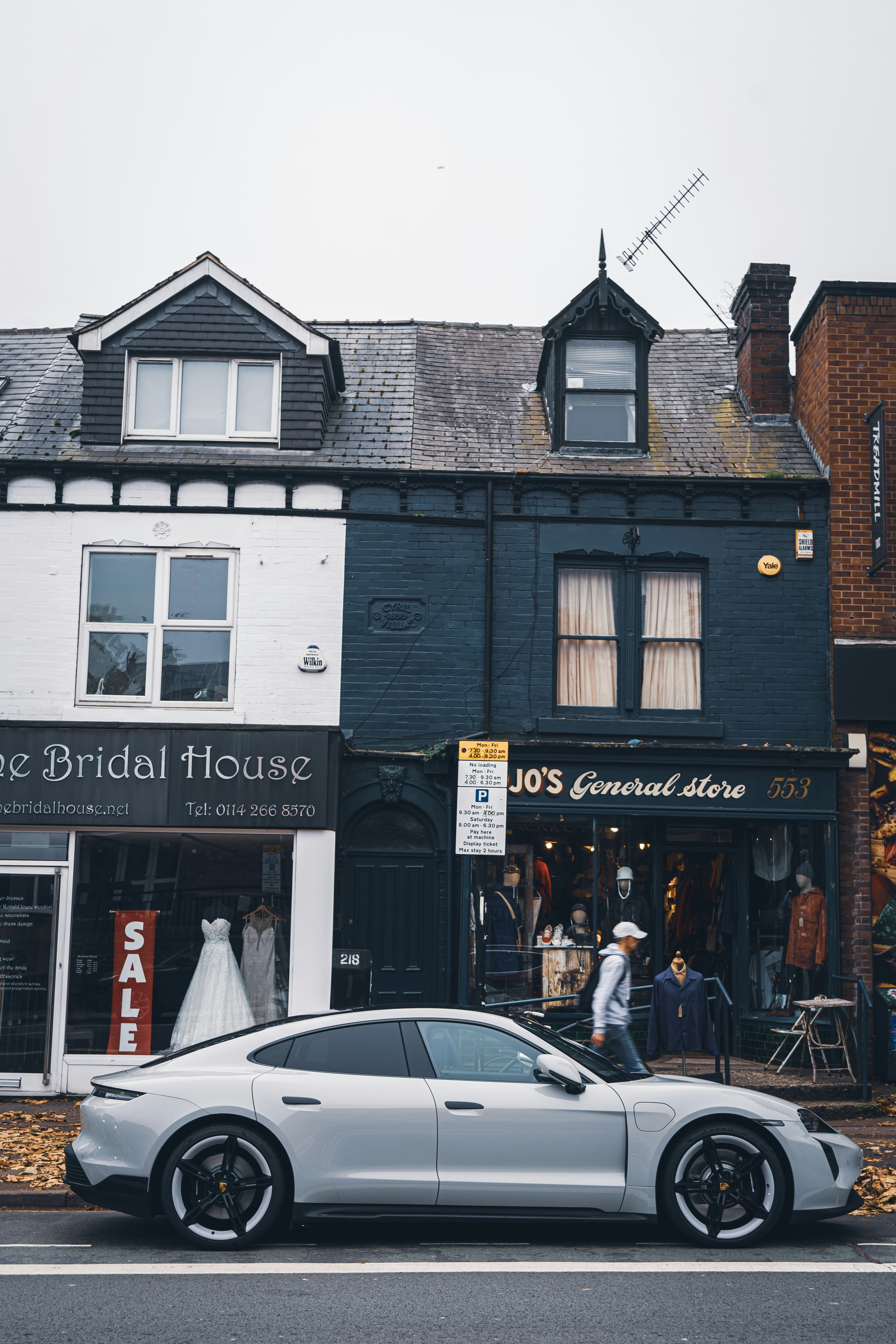 A white car parked outside a store photo – Free Sheffield Image on Unsplash