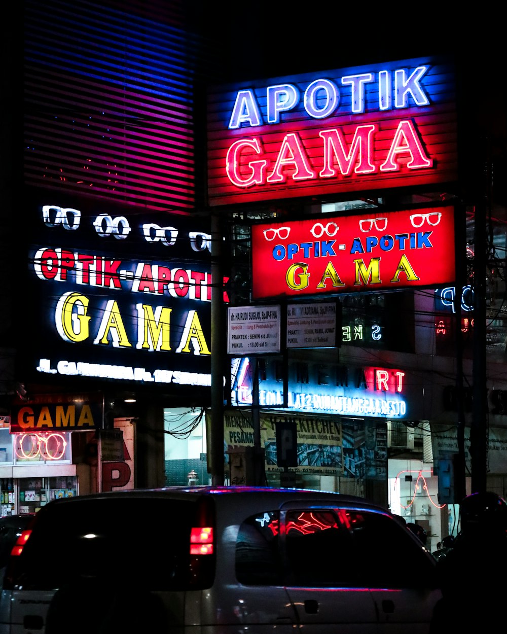 a street with neon signs