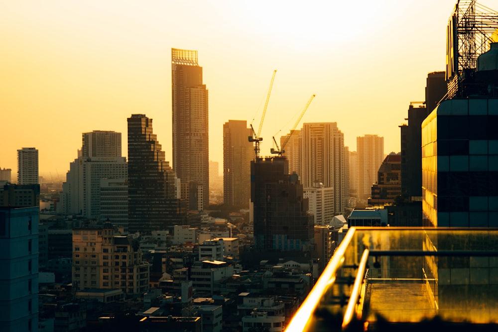 a city skyline with cranes