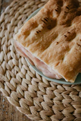A close-up of a delicious kabab sandwich wrapped neatly, ready for delivery.
