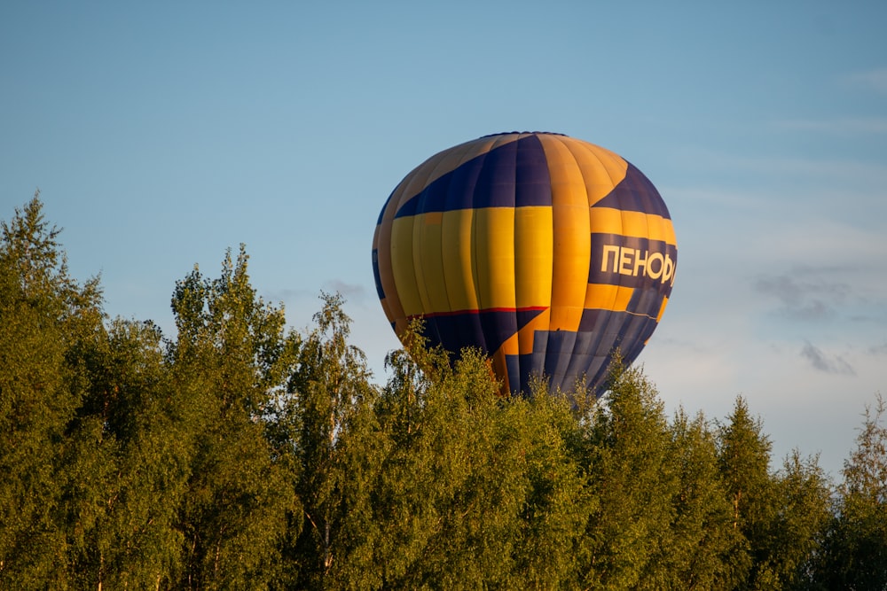 a hot air balloon over trees