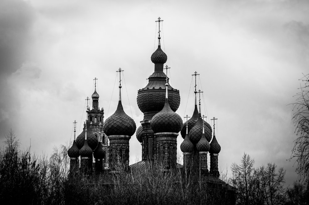 a group of towers with pointy roofs