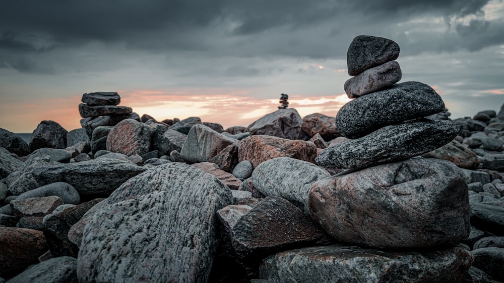 a person sitting on a pile of rocks