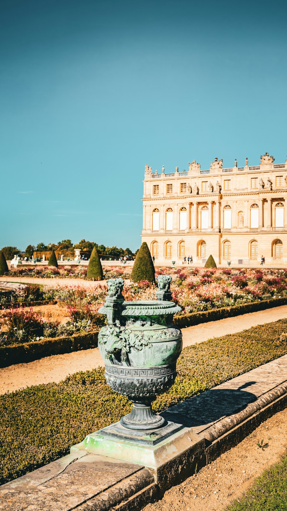 a large building with a fountain in front of it